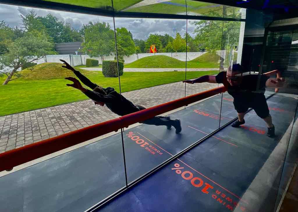 Beat the storm wind tunnel with visitors leaning